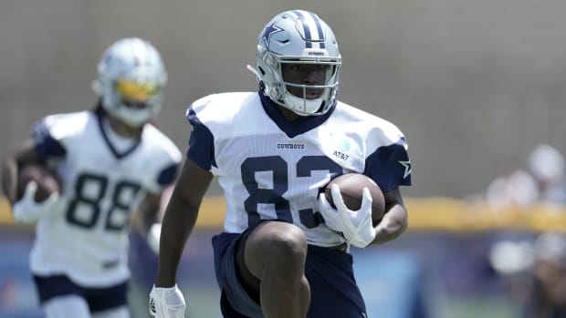 Cowboys receiver James Washington (83) carries the ball during training camp at the River Ridge Fields.